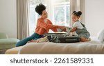 Small photo of Travel, luggage and mom packing with child in bedroom getting ready for trip. Helping hands, black family and young girl help mother pack clothes in suitcase for holiday, vacation and weekend away