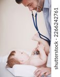 Small photo of His young patients are often wriggly. Cropped shot of a male doctor examining an infant girl.