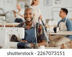 Fashion designer, young man and creative in a workshop stitching clothes. Portrait of a happy, smiling and cheerful factory worker at a sewing machine in a textile startup and manufacturing studio