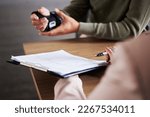 Small photo of Hand injury, document and man compensation paperwork, insurance, legal contract or lawyer consulting. Disability people, attorney or advocate in negotiation, policy advice or accident report closeup
