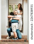 Small photo of Loving dad hug and embrace son, love from father to son or parents saying goodbye to child on front porch at home. Happy family greeting little boy with mother standing in doorway or house entrance.