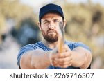 Target, focus and axe throwing with man in nature and aim for sports, training and tomahawk skills. Exercise, goal and hunting with athlete and hatchet in range for bullseye, ready and competition