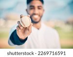 Baseball field, portrait and pitcher holding ball on match or game day on a sports ground or pitch feeling happy. Sport, athlete and blur pitcher at training with a smile due to health and wellness