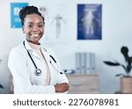 Small photo of Happy, portrait and black woman doctor proud in hospital, excited or cheerful for healthcare innovation. Face, confident and female health expert smile for medical, mission or ready to help at clinic