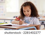 Small photo of Learning, drawing and girl in classroom for education, exam or studying with book. Preschool, creativity development and serious kid or student coloring for art in notebook in kindergarten or academy