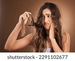 Small photo of Hair loss, crisis and worried woman in studio for beauty, messy and damage against brown background. Haircare, fail and sad girl frustrated with weak, split ends or alopecia, dandruff and isolated
