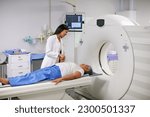 Small photo of Doctor, mri and woman holding hands of patient in hospital before scanning in machine. Ct scan, comfort and medical professional with senior female person in radiology test for healthcare in clinic.