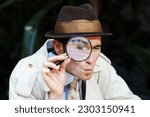 Small photo of Private investigator, eye in magnifying glass and portrait of man for detective, searching and looking. Spy, investigation and male person with magnifier for secrets, information and mystery clue