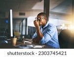 Black business man, stress and fatigue in night, office and headache by computer for project deadline. African businessman, burnout or anxiety in workplace by pc, web design startup and mental health