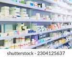 Small photo of Pharmacy, shelf and boxes for product, empty or pharmaceutical stock for wellness, health and interior. Shop, store and retail healthcare with storage, choice or sale for wellness, discount and drugs