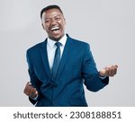 Happy, portrait and a black man with corporate success isolated on a white background in a studio. Win, excited and an African businessman cheering in celebration for professional achievement