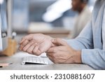Business man, computer and wrist or carpal tunnel pain in office with a keyboard and tech. Hand of male entrepreneur for physical therapy massage on injury, muscle or problem with stress or syndrome