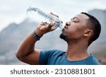 Small photo of Drinking water, fitness and black man in nature for exercise, marathon training and running outdoors. Sports, workout and thirsty male person rest to drink liquid for hydration, wellness and health