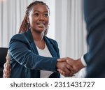 Business woman, handshake and agreement for partnership in office for collaboration, promotion or welcome. Black female entrepreneur and employee shaking hands for interview, greeting or b2b deal
