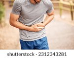 Small photo of Fitness, stomach ache and man outdoor after running, workout or exercise. Sports, abdominal pain and male athlete in nature with injury, emergency or problem, sick or hernia after training mockup.