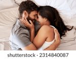 Small photo of Smile, bed and happy couple hug, relax and spending lazy morning together, bonding and intimacy on Spain vacation. Happiness, marriage and top view of romantic man, woman or people embrace in bedroom