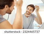 Small photo of Bathroom, mirror reflection and happy man with hair care routine for maintenance, beauty process or hygiene cleaning treatment. Smile, morning and home person style locks for clean shampoo hairstyle