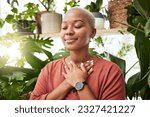 Small photo of Balance, breathing and young woman by plants for zen meditation in a greenery nursery. Breathe, gratitude and young African female person with a relaxing peace mindset by an indoor greenhouse garden.