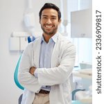Small photo of Dentist, portrait and man with arms crossed for healthcare service, dental hospital or insurance in consultation office. Happy asian person or doctor with teeth, oral or hygiene health in clinic