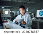 Small photo of Tablet, planning and scientist with digital innovation, data and reading in laboratory. Asian man, doctor and information technology for futuristic medical research with pharma healthcare study