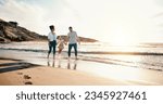 Small photo of Walking, bonding and family on the beach for vacation, adventure or holiday together at sunset. Travel, having fun and girl child with her mother and father on the sand by the ocean on weekend trip.
