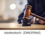 Law, judge and closeup of lawyer with gavel for justice, court hearing and legal trial for magistrate. Government, attorney career and zoom of desk for investigation, criminal case and verdict order