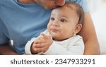 Small photo of Father, baby and kiss in home for love, care and affection, bonding together and cute. Dad, newborn and smooch kid, infant or toddler, relax and enjoying quality family time with parent in house.