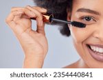 Small photo of Makeup, beauty and portrait of woman with mascara in studio for wellness, skincare product and cosmetics. Salon, aesthetic and half face of person with eyelash wand for glamour, makeover and glow