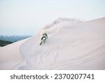 Small photo of Motorcycle, desert and race for sports in sand, adrenaline and training for fitness in competition. Athlete, sky and mockup for extreme sport, driving and dirtbike in outdoor for stunt or performance