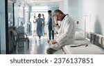 Small photo of Depression, grief or fail with a mature doctor in a hospital looking unhappy for healthcare or medical. Stress, mistake or loss with a sad man medicine professional in a professional medicare clinic