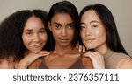 Small photo of Women, underwear and beauty of diversity friends in studio for portrait, inclusion or wellness. Model people hug on neutral background as different body care, skin glow or natural cosmetic comparison
