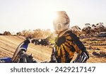 Small photo of Sports, dirtbike and man in helmet, training and off road riding with desert glare. Extreme transport, bike and gear for motorbike competition, freedom and adrenaline for professional racing male