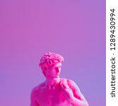 Small photo of Creative concept of purple neon David is a masterpiece of Renaissance sculpture created by Michelangelo. Vaporwave style