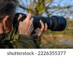 Man With Telephoto Lens...