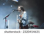 Small photo of Clarkston, MI - June 18 2023: Brian Bell of Weezer preforming at Pine Knob Music Theater