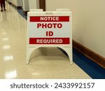 Small photo of Kimbrell campus polling site at Belmont, Gaston county, North Carolina USA. March 05, 2024. Sign for photo ID requirement for elections in North Carolina.