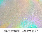 Small photo of Blurred defocused abstract iridescent foil wallpaper texture. Holographic soft pastel colors backdrop. Colorful rainbow gradient poster, banner background. Minimal liquid owerflow, unicorn aesthetic