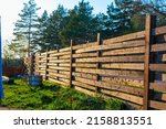 wooden fence in the village on the edge of the forest