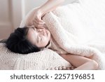 Asian woman sleeping due to lack of sleep (yawning)