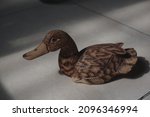 A Duck Statue Made Of Wood As A ...