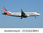 Small photo of Miami, FL, USA - 24 November 2021: American Eagle (Envoy Air) Embraer EMB-175 Jet Aircraft, Landing at the Miami International Airport, Florida.