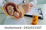 Small photo of Pills and vitamins during pregnancy artificial insemination and gynecologist. Fetal health and embryo protection