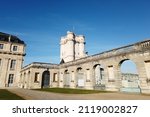 The Château de Vincennes (14th century) and its magnificent keep and arcades near Paris, France on a beautiful blue and sunny sky