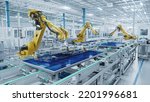 Small photo of Large Production Line with Industrial Robot Arms at Modern Bright Factory. Solar Panels are being Assembled on Conveyor. Automated Manufacturing Facility
