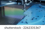 Small photo of Silicon Dies are being Extracted by a Pick and Place Machine from Wafer and Attached to Substrate. Computer Chip Manufacturing at Factory. Close-up of Semiconductor Packaging Process.