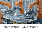 Small photo of EV Battery Pack Automated Production Line Equipped with Orange Robot Arms. Electric Car Smart Factory. Row of Advanced Robotic Arms inside Bright Plant Assemble Batteries for Automotive Industry