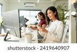 Small photo of Friendly female colleagues having good relationships,Colleagues in office.pleasant conversation at workplace during coffee break, smiling young woman listen talkative coworker,happy,good Colleagues