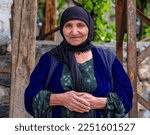 Small photo of Hakkari Turkey 05-08-2022 A Kurdish woman in a red colored outfit