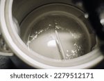 Close up of electric kettle with limescale in hard water area, region. Top view. Selective focus. Preparation for descaling