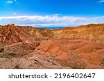 Small photo of Fairytale Canyon Skazka in Kyrgyzstan, fairy tale valley, South shore of Lake Issyk Kul also called rainbow mountains. Martian landscape on earth